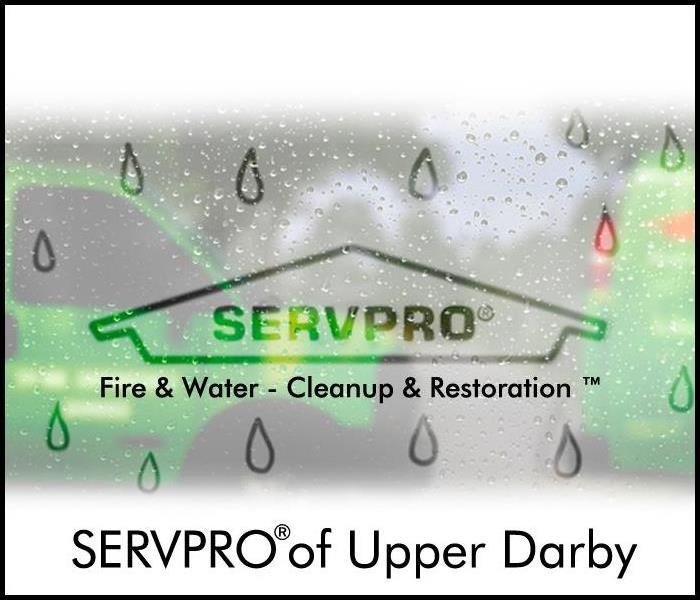 SERVPRO of Upper Darby logo on foggy wet window with green truck
